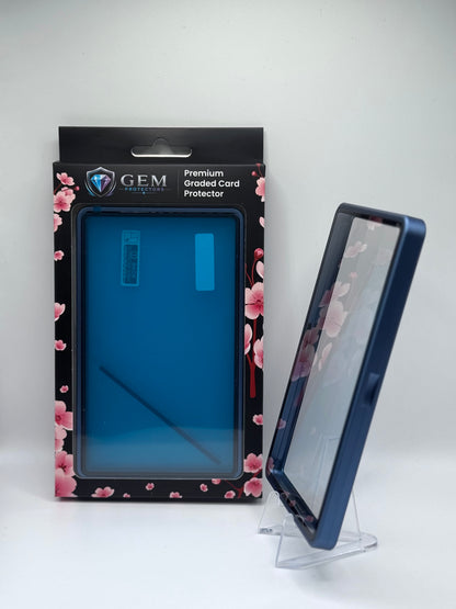 Cosmic Blue Gem Protectors case angled on a clear stand to show the frame's side profile, next to its retail box
