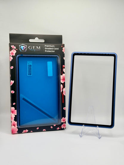 Front view of the empty Cosmic Blue Gem Protectors case showing the frame and clear panel, beside its retail box