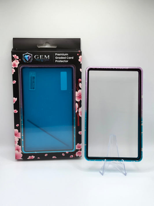 Blue & Purple Gem Protectors magnetic PSA slab case standing upright on a clear stand next to its retail box