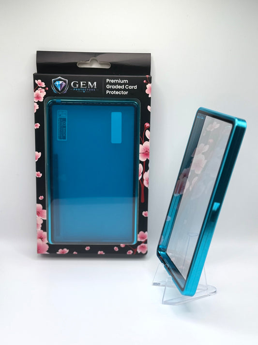 Teal Gem Protectors case angled on a clear stand to show the frame's side profile, next to its retail box