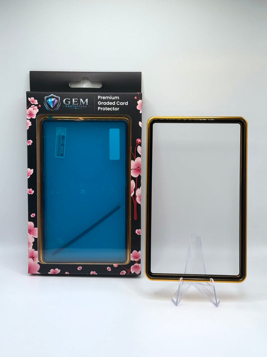 Gold Gem Protectors magnetic PSA slab case standing upright on a clear stand next to its retail box